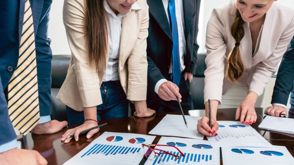 Photo of stakeholders engaging with insights as part of an organisation strategy 